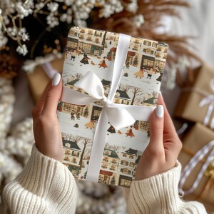 a woman holding a wrapped present in her hands