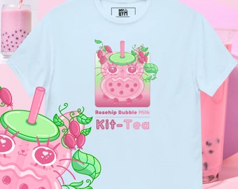 May include: A light blue t-shirt featuring a cartoon illustration of a pink bubble tea with a green lid and straw. The bubble tea has a cute cat face with pink cheeks and hearts for eyes. The text "Rosehip Bubble Milk Kit-Tea" is printed below the illustration.