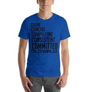 May include: A royal blue t-shirt with black text that reads "CLEAR, CONCISE, COMPELLING, CONSISTENT, COMMITTED, C5 COMPLEX".