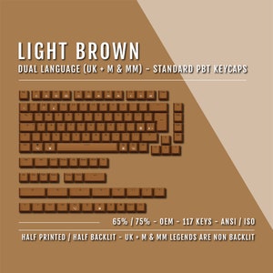 May include: Light brown PBT keycaps for a 65% or 75% keyboard layout. The keycaps feature a dual language design with UK, US, and International symbols. The keycaps are half printed and half backlit, with the UK, US, and International legends being non-backlit.
