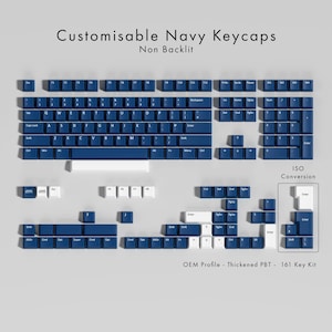 May include: A set of navy blue keycaps for a mechanical keyboard, with white lettering. The keycaps are arranged to show the layout, including the QWERTY keys, function keys, and number pad. The text "Customisable Navy Keycaps" is at the top.