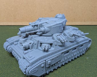 May include: A grey model tank with multiple turrets, cannons, and detailed track treads. The miniature tank is made of a solid material and sits on a green surface. The tank has a detailed design with rivets and hatches.