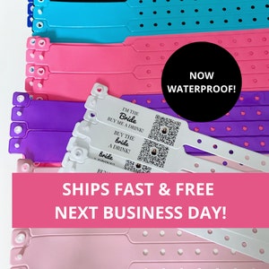 May include: A stack of white, pink, purple, and blue wristbands with the text "I'm the Bride Buy me a drink!" and a QR code. The wristbands are waterproof and ship fast and free the next business day.