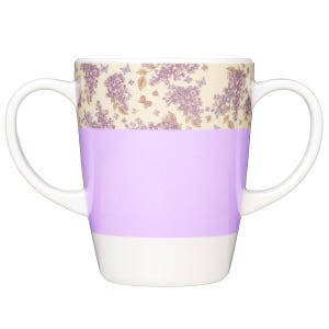 May include: A two-handled mug featuring a cream-colored upper band decorated with a pattern of purple lilac flowers and small butterflies. The middle section is a solid light purple, while the bottom base and the two side handles are white.