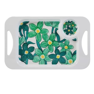 May include: White serving tray with a floral design. The tray has a rectangular shape with rounded corners, handles, and a circular compartment. The floral pattern includes green and teal flowers with yellow centres on a white background.