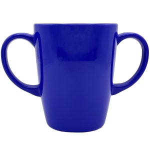 May include: A bright blue ceramic mug with two handles. The mug is designed for easy gripping and is perfect for children.