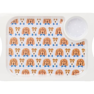 May include: White serving tray with a removable bowl. The tray features a repeating pattern of brown and white dogs wearing blue bow ties.