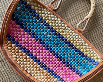 Vintage rainbow multicolored woven grass , straw, rattan purse with bamboo handles, purple , blue, yellow, pink stripes