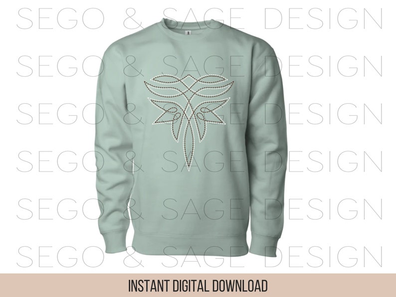 May include: A light green sweatshirt with a brown and white geometric design on the front. The design resembles a stylized butterfly.