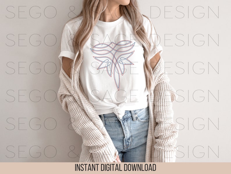 May include: A white t-shirt with a red, white, and blue geometric design on the front. The design resembles a stylized butterfly.