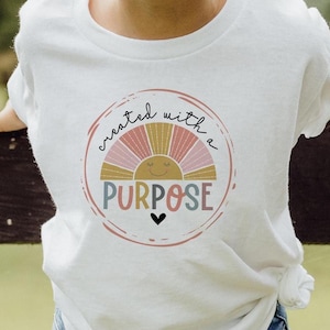 Camiseta infantil cristã PNG criada com um propósito Arte baseada na fé Download digital Camiseta religiosa PNG