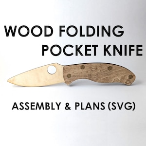 May include: A wooden folding pocket knife with a light wood blade and a darker wood handle. The handle has three small, round, decorative rivets. The text "WOOD FOLDING POCKET KNIFE" and "ASSEMBLY & PLANS (SVG)" are printed above and below the knife.