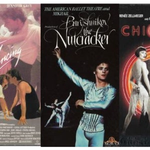 May include: Three VHS movie covers: "Dirty Dancing" with Patrick Swayze, "The Nutcracker" featuring Mikhail Baryshnikov, and "Chicago" starring Renée Zellweger and Richard Gere. The covers feature actors and dancers in various poses, with titles in bold fonts.