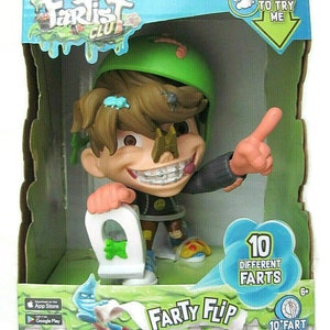 May include: A green, brown, and black toy figure of a boy wearing a green helmet and a black shirt. The figure is holding a white toilet with a green seat. The figure has a green slime on its face and a green slime on the toilet. The figure is labeled "Farty Flip" and has a label that says "10 Different Farts".