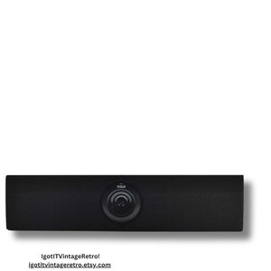 May include: Black RCA soundbar speaker with a circular speaker grill in the center.