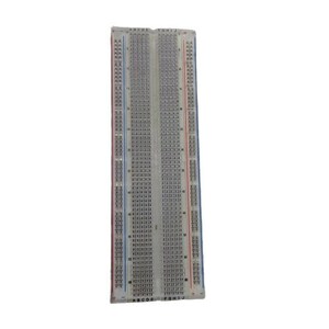 May include: A white plastic breadboard with rows of holes for connecting electronic components. The breadboard has labels for rows A-J and columns 1-30.