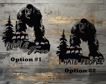 May include: Two black and white silhouette designs of a Bigfoot or Sasquatch standing on a rock with a pine tree behind it. The first design says "Wild & Free" and the second design says "I Hate People".