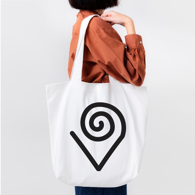 May include: White tote bag with a black spiral design in the shape of a location pin.