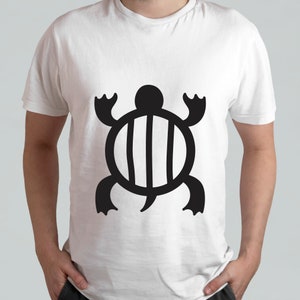 May include: White t-shirt with a black stylized turtle design. The turtle has a round shell with vertical lines and a long tail.