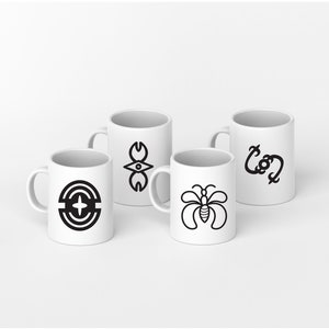 May include: Four white ceramic mugs with black graphic designs. The designs include a stylized eye, a circle with a cross, a butterfly, and a stylized letter 'C'.