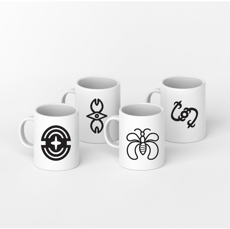 May include: Four white ceramic mugs with black graphic designs. The designs include a stylized eye, a circle with a cross, a butterfly, and a stylized letter 'C'.