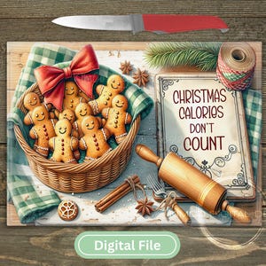 May include: A festive Christmas-themed illustration featuring a basket of gingerbread men, a red bow, and a sign that reads "Christmas Calories Don't Count." A rolling pin, knife, and spices complete the holiday scene.