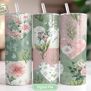 Puede incluir: Tres vasos con temática floral con pajitas. Cada vaso presenta un diseño de corazón con flores y elementos botánicos en tonos rosa, verde y blanco. Los vasos tienen el texto "Descarga instantánea" y "Archivo digital".