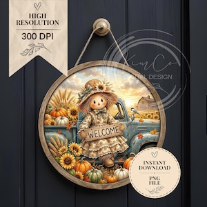 May include: A round wooden sign featuring a scarecrow wearing a straw hat and a patterned dress, holding a sign that reads WELCOME. The scene includes a blue vintage truck, sunflowers, pumpkins, and a barn in the background, all set against a sunset sky.
