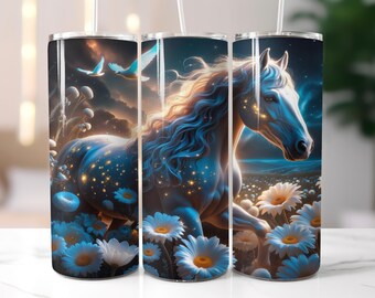 May include: Three stainless steel tumblers with a fantasy art design. The design features a white horse with a flowing mane, surrounded by blue flowers and a starry sky. Two birds fly in the background. The tumblers have a white straw.