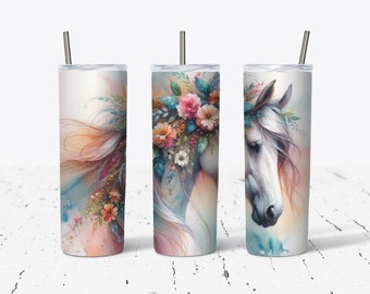 May include: Three stainless steel tumblers with a white horse with a floral crown design. The horse is painted in shades of blue, pink, and white. The tumblers are 20 ounces.