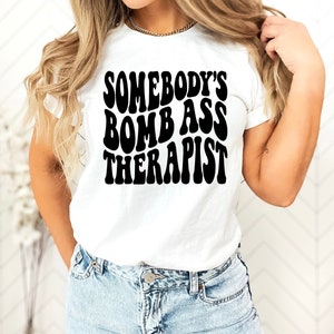 Somebody&#39;s Bomb Ass Therapist T Shirt / Therapist Gift / Therapist Shirt