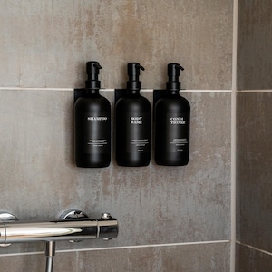 Shower dispenser set including self-adhesive wall brackets and bottles (all black edition) I Soap dispenser made of glass in matt black