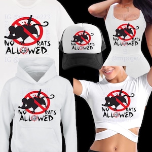 Peut inclure: Un ensemble de vêtements blancs avec un motif représentant un rat avec un couteau qui le traverse et le texte "NO RATS ALLOWED". L'ensemble comprend un t-shirt, un sweat à capuche, un débardeur et une casquette de camionneur.