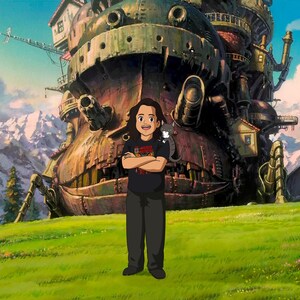 May include: An animated scene featuring a person standing in front of a large, detailed, moving castle. The person is wearing a black t-shirt and trousers. The background includes mountains, trees, and a blue sky.