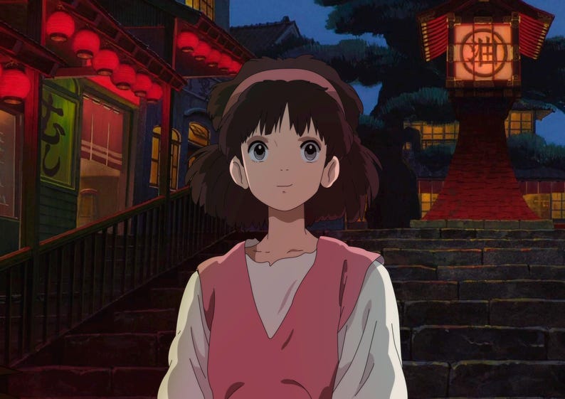 May include: An animated illustration of a young girl with brown hair and a pink headband, wearing a pink vest over a white shirt. She stands in front of a building with red lanterns and a traditional Japanese lantern.