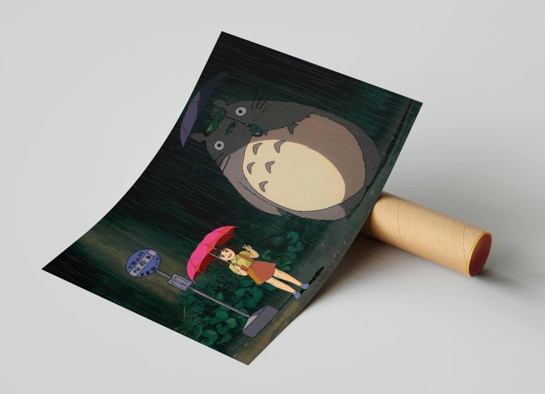 May include: Poster print of a scene from the animated film, My Neighbour Totoro. The artwork shows Totoro, a large forest spirit, and a young girl with an umbrella at a bus stop in the rain. The poster is rolled up.