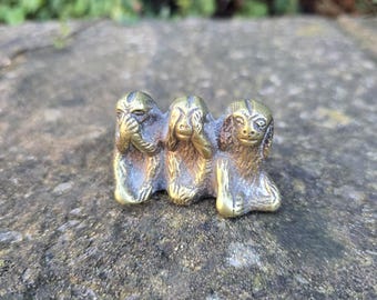 Cute brass ornament of three wise monkeys