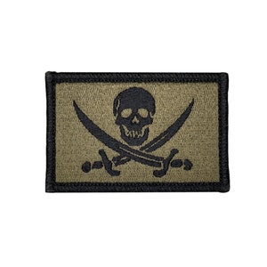 Calico Jack Rackham olive drab jolly roger pirate flag. 2x3 inch morale badge velcro tactical hook and loop. Made in USA
