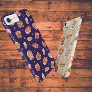 May include: Two phone cases with different food designs. The first case is purple with a pattern of burgers, fries, popcorn, ice cream cones, and stars. The second case is beige with a pattern of burgers, fries, chicken wings, and wraps.