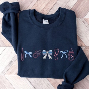 Mother Baby Nurse Sweatshirt, Baby Blanket Nurse Crewneck, Postpartum Nurse Sweater, Maternity Nurse Grad Gift, Girly MBU Bow Sweatshirt