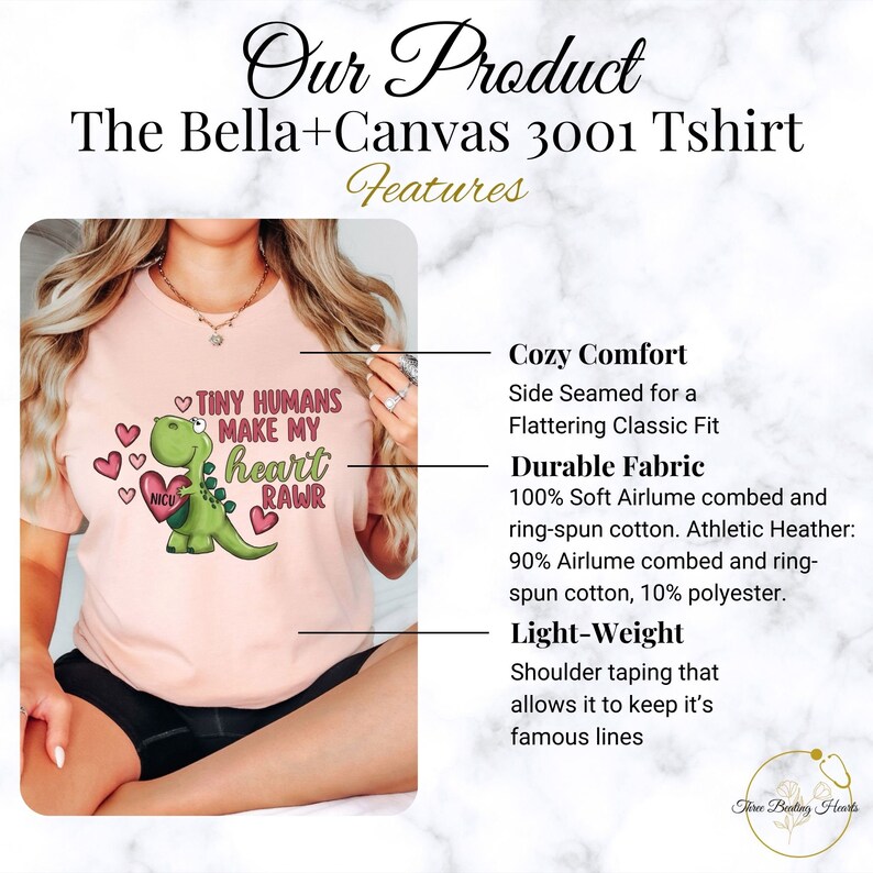 May include: Pink Bella+Canvas 3001 T-shirt with a green dinosaur graphic and the text "Tiny Humans Make My Heart Rawr". The shirt features a side-seamed classic fit, soft airlume combed and ring-spun cotton, and shoulder taping.
