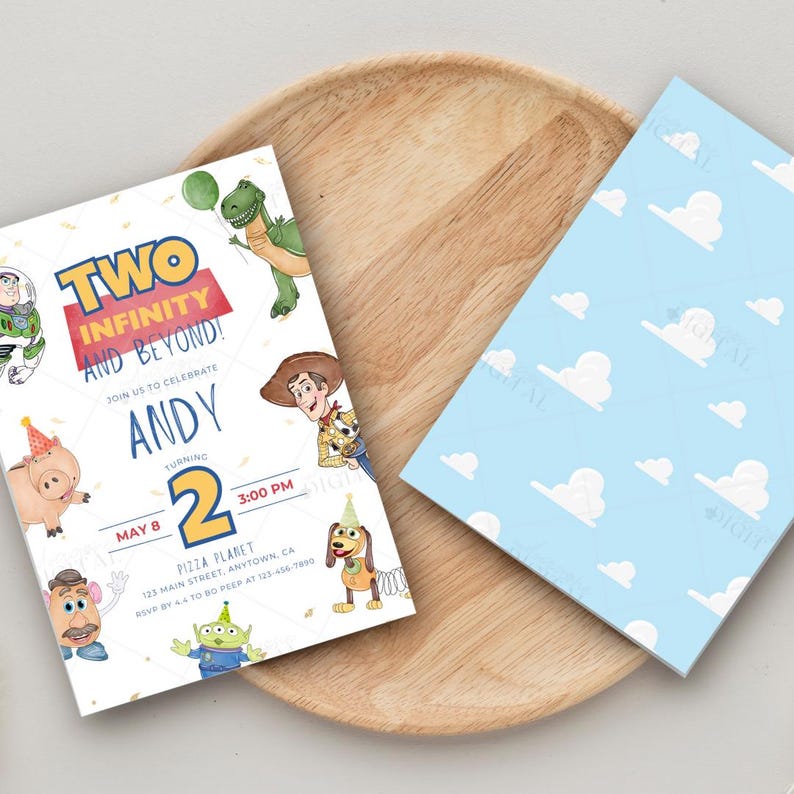 May include: Two invitations with a Toy Story theme. One features the text "Two Infinity and Beyond!" and "Andy" with character illustrations. The other has a blue sky background with white clouds. Both are on a wooden tray.
