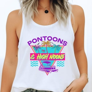May include: White tank top with a graphic design of a pontoon boat, palm trees, and the text "Pontoons & High Noons" in a retro style.