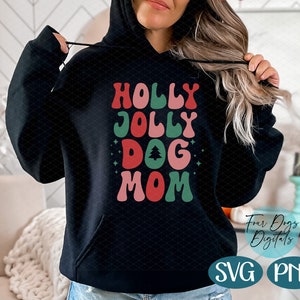May include: Black hoodie with a red, green, and pink graphic that says "Holly Jolly Dog Mom" with a small green Christmas tree graphic.
