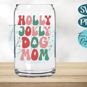May include: A clear glass tumbler with a red, green, and pink design that says "Holly Jolly Dog Mom".