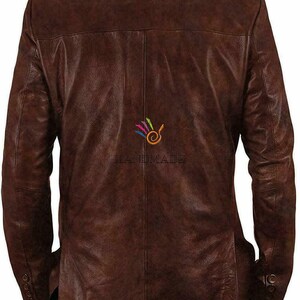 May include: A brown leather jacket with a button-up front and long sleeves. The jacket has a slightly distressed look and is made of a soft, supple leather.