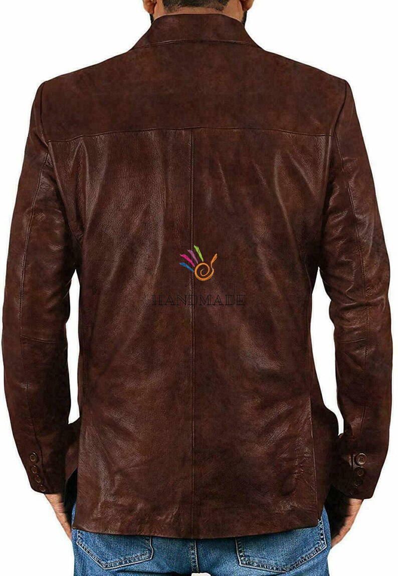 May include: A brown leather jacket with a button-up front and long sleeves. The jacket has a slightly distressed look and is made of a soft, supple leather.