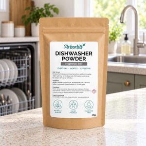 May include: A 1kg brown paper pouch of Arborfill dishwasher powder with a white label. The label features the text DISHWASHER POWDER, instructions, ingredients, precautions, and three circular icons representing naturally derived, family friendly, and fragrance free features.