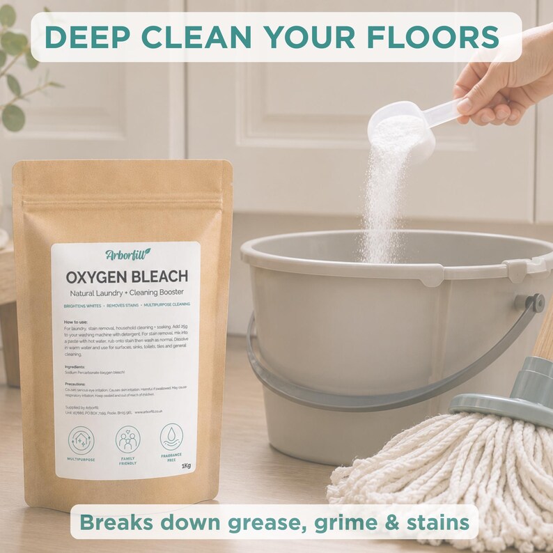 May include: A 1kg pouch of Arborfill Oxygen Bleach with a white label featuring instructions and ingredients, positioned next to a grey bucket and a mop. White powder is being poured from a measuring scoop into the bucket. Text reads DEEP CLEAN YOUR FLOORS.