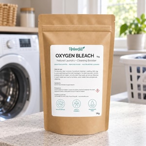 May include: A 1kg brown paper pouch of Arborfill Oxygen Bleach, a natural laundry and cleaning booster. The white label features black text detailing usage instructions, ingredients, and precautions, alongside three circular icons for multipurpose, family friendly, and fragrance free use.